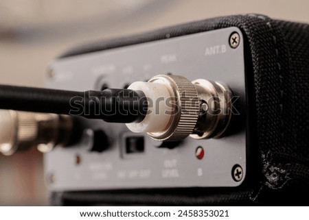 Close-up of a coaxial cable connected to a device