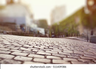 Closeup of the cobblestone pavement in Montmartre, Paris. Miniature tilt shift lens effect.