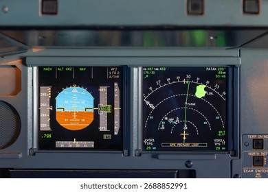 Close-up of cockpit flight instruments and navigation display in modern airplane