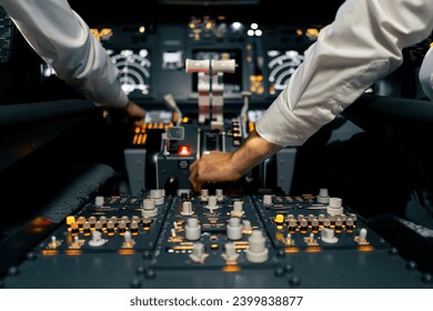 close-up of the cockpit of a passenger plane with many buttons on the control panel of airplane flight simulator - Powered by Shutterstock