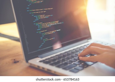 Closeup coding on screen, Woman hands coding html and programming on screen laptop, development web, developer.