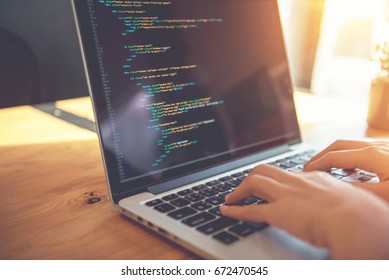 Closeup coding on screen, Woman hands coding html and programming on screen laptop, development web, developer.