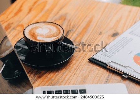 Closeup of coffee cup on table in empty corporate conference room before business meeting in office