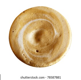 Close-up Of Coffee Foam Isolated Over A White Background, Viewed From Top.