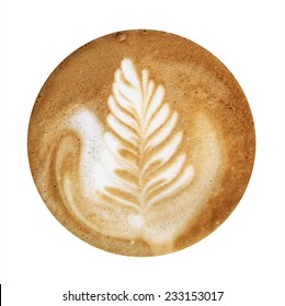 Closeup up of coffee latte foam with leaf design art isolated on a white background, viewed from top.