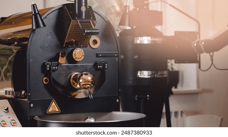 Closeup coffee roasting machine, small food industry.