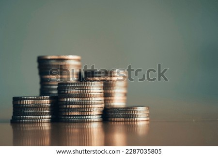 close-up of the coins stack for a financial business presentation background, home loan, money saving, stock and fund management, retirement plan concept, business growth, profit, selective focus