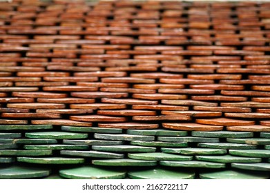 Closeup color roof tiles Thai temple, selective focus at green roof tiles.