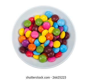 Close-up Of Colored Candy In A Bowl, Isolated On A White Background