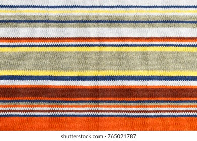 Closeup of colored knitted wool texture. Fabric multicolor background.