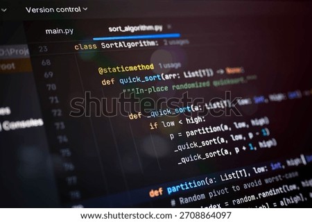Close-up of colorful abstract programming code showing a recursive sorting algorithm on dark background, suitable for illustrating logic structures, software development, or coding tutorials.