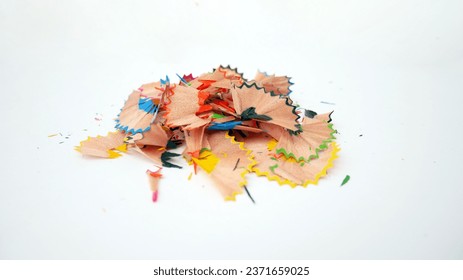 Close-up of colorful pencil shavings on a white background. Whole and broken lead pencils on white background. The rest of the pencil. Macro, pile of shavings - Powered by Shutterstock