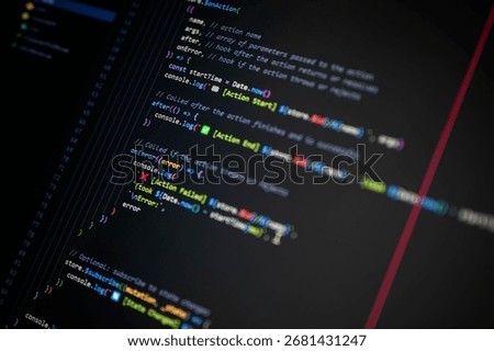 Close-up of colorful programming code on screen showing console.log with Action Start, End, and Failed for debugging and error handling, symbolizing software development and digital technology.