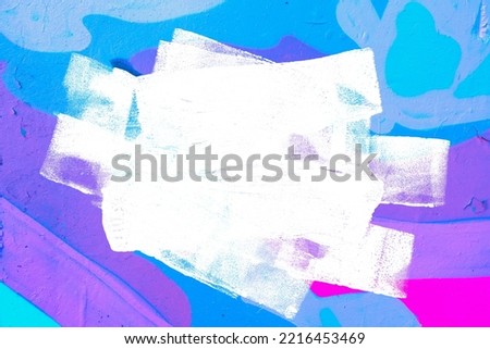 Closeup of colorful purple, pink, blue urban wall texture with white white paint stroke. Modern pattern for design. Creative urban city background. Grunge messy street style background with copy space