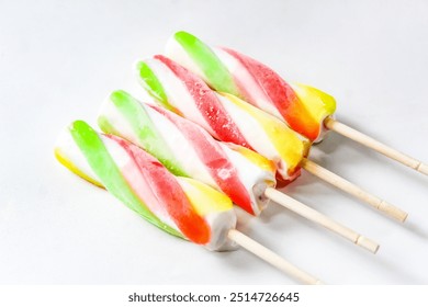 closeup of colorful spiral popsicle isolated on white background - Powered by Shutterstock