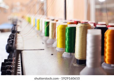 Closeup Colorful Spool of Thread on the Sewing Equipment, Fabric and Textile Industry, Embroidery machine, nobody - Powered by Shutterstock