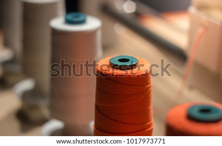 Image, Stock Photo Spools of Orange Yarn in Industrial Textile Production