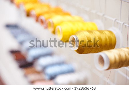 Similar – Image, Stock Photo Spool of thread on a blue jeans