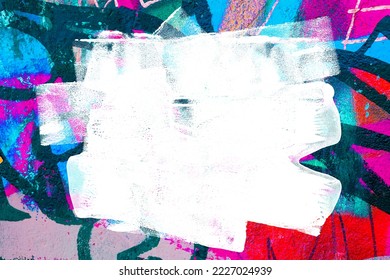 Closeup of colorful teal, blue and red urban wall texture with white white paint stroke. Modern pattern for design. Creative urban city background. Grunge messy street style background with copy space