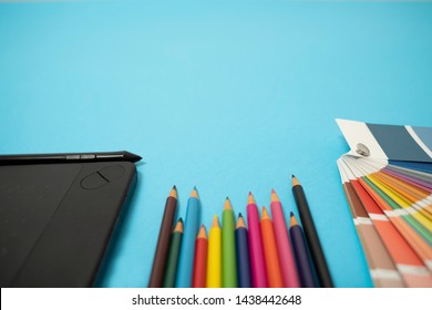 Closeup Of Colorful Wooden Pens Color Palette And  Drawing Board 