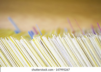 Closeup Of Colour Coded Filing System For Folders