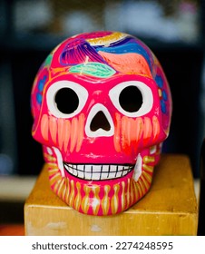 Closeup of a colourful ceramic skull.