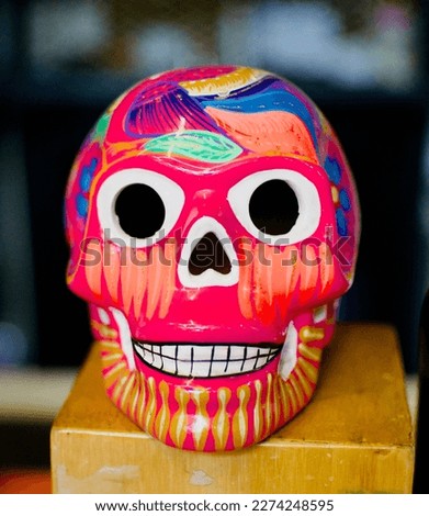 Closeup of a colourful ceramic skull.