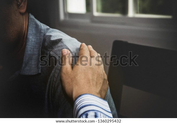 Close-up, comforting
male hands that hope for close friends to have suffering that is
ready to help and
care.

