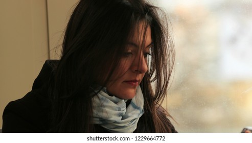 Close-up Of Commuter Woman Riding Train To Work