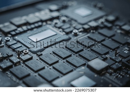 Close-up computer board, chipset, electronics, small electronics board, technology, high-tech chipset, circuitboard. unique electronic device, 2023 model, conductors, microchips, CPU socket, miniature