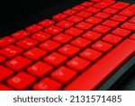 Close-up computer keyboard. red keyboard, background.
