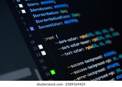 close-up of computer screen with colorful css code, focus on root selector, web development, frontend design and programming
