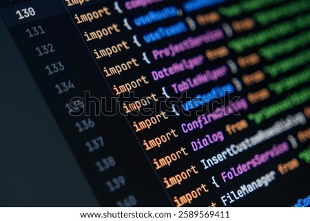 close-up of computer screen with colorful javascript code, focus on import statement, software development and programming
