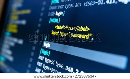 Close-up of computer screen displaying HTML code for password input field