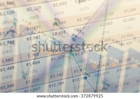 Close-up computer screen with financial data. Multiple exposure photo.