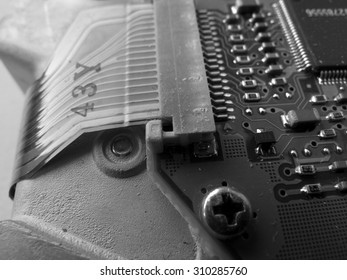 Closeup of computer's hard disk device . black and white photo