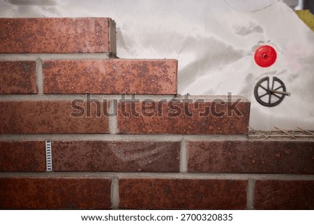 Closeup of construction materials and textures, Comprehensive depiction of outer wall during renovation showing various building materials