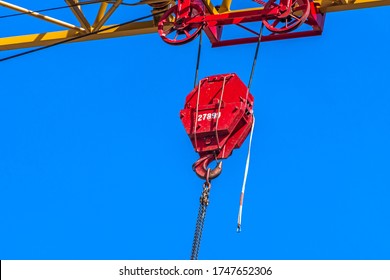 Close-up Of Construction Pulley Crane In The Blue Sky