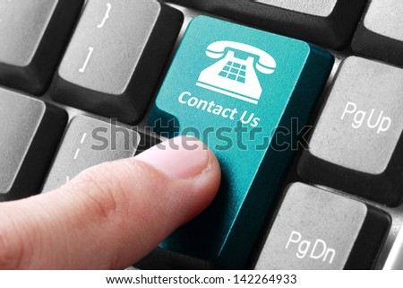 Closeup of contact us button on the keyboard