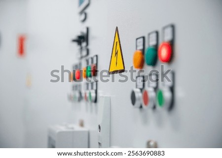 Closeup control panel with light lamp of switchboard equipment high voltage of power plant.