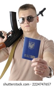 Close-up Of A Cool Handsome Young Man In A Beige T-shirt With Sunglasses Holding An Assault Rifle And Showing Ukrainian Passport Isolated On White Background