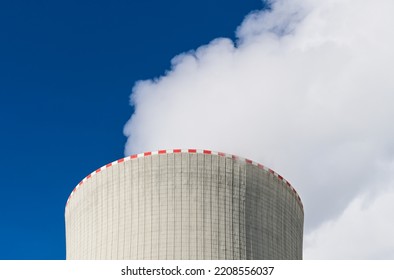 Closeup Of Cooling Tower Top With Warning Red Broken Line And White Steam Plume On Blue Sky Background. Waste Heat Rejection From Nuclear Power Plant To Air By Water Evaporation In Concrete Structure.