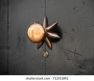 Closeup Of A Copper Doorknob With A Small Peephole Under It