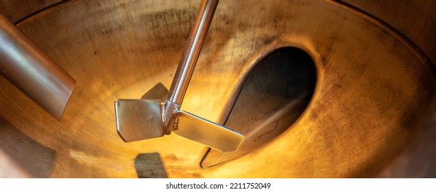 Close-up Of A Copper Still With A Stainless Steel Agitator Taken At A Gin Distillery.Copy Space For Your Design. Web Banner.