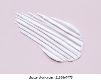 close-up cosmetic smear cream texture on pastel pink background - Shutterstock ID 2183867475