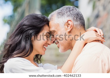 Close-up of couple embracing outdoors
