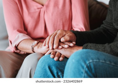 Closeup, couple and holding hands to forgive, love and care with empathy at home. Life partner, helping hand and support of man, woman and hope for kindness, trust or gratitude for therapy of anxiety - Shutterstock ID 2326402869