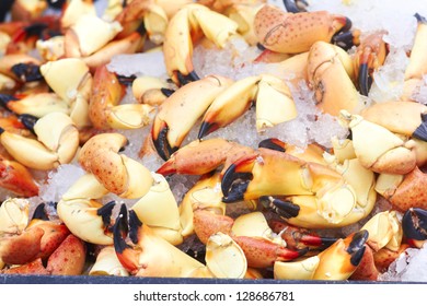 Close-up of crabs preserved in ice for sale. Horizontal Shot.