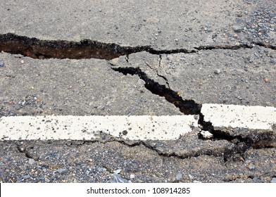 Closeup Of Cracked Asphalt Road