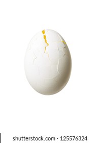 Close-up Of A Cracked Egg Displayed On White Background.